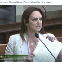 A woman in a light-colored blazer speaks while holding papers at an Assembly Labor and Employment Committee meeting on Wednesday, June 19, 2024. The text at the bottom of the screen reads "SB 1264" and "Grove," highlighting discussions about employment protections related to off-the-job cannabis use. CA Norml