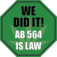 Green octagonal sign with a faint marijuana leaf in the background. Bold text reads: "WE DID IT! AB 564 IS LAW. CA Norml