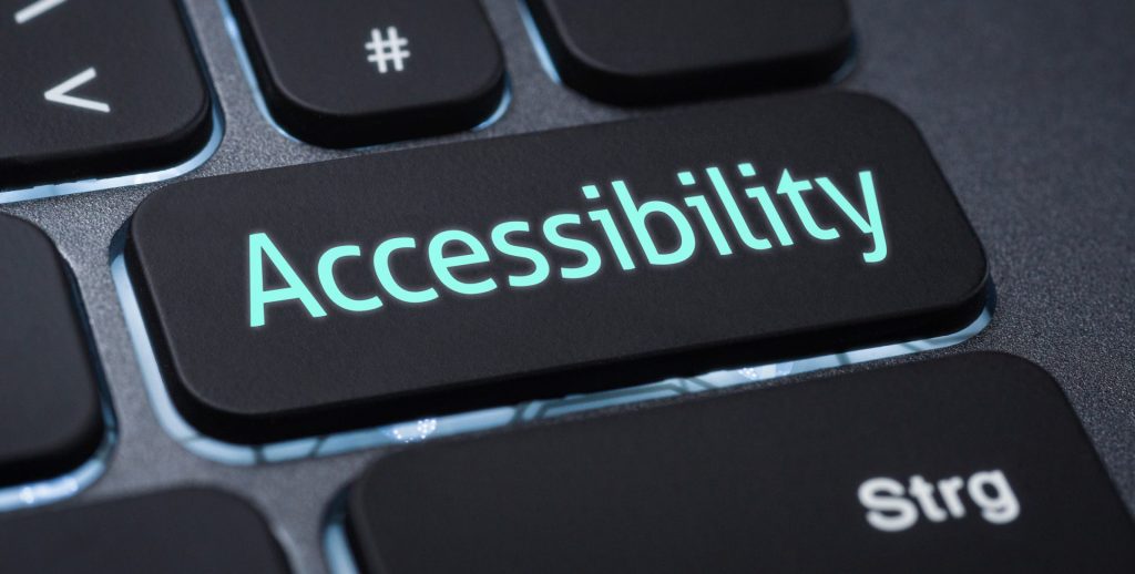 A close-up of a keyboard with a large black key labeled “Accessibility” in glowing blue letters, highlighting the importance of ADA compliance for any cannabis website. Ca NORML
